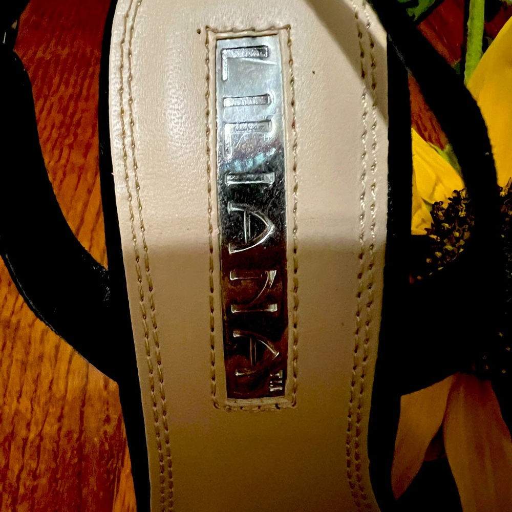 Black shoes with stones.